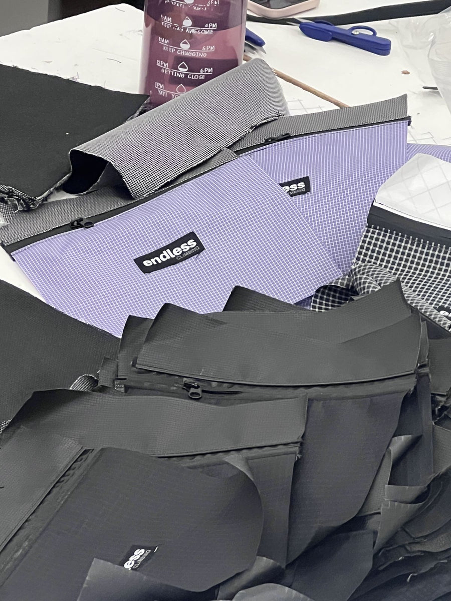 Cut panels and finished pouches in various colorways